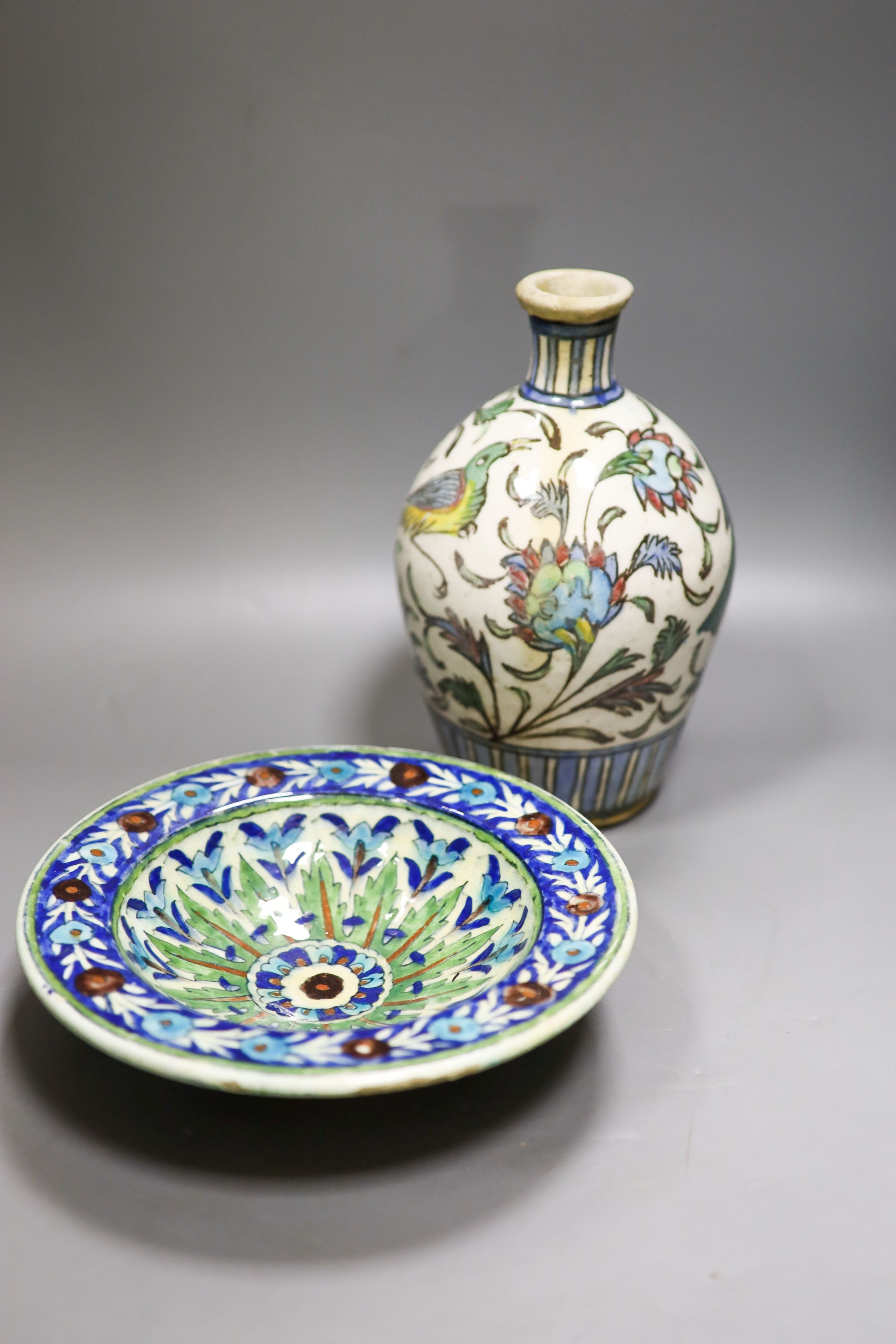 A Persian Iznik style pottery bowl and a Persian Qajar dynasty vase, 22.5cm